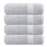 GLAMBURG front view of four light grey towels showing neat packaging benefit softness