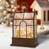 GlexpFesti front view of greenhouse snow globe showing warm glow benefit