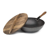 Goodful wok front view showing hammered steel and wooden lid for professional cooking