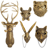 GUASDIE front view of five gold animal heads showing elegant room focal point