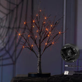 Hairui front view showing black glitter tree on tabletop, adds spooky ambiance