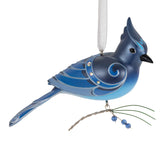 Hallmark Keepsake Steller's Jay front view showing vibrant blue and holiday sparkle