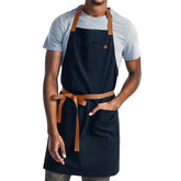 hedley & bennett front view of midnight blue apron showing full coverage and professional look
