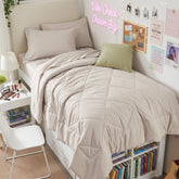 HEVUMYI comforter front view showing neutral beige and neat finish benefits a tidy bed