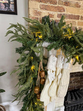 HomeKaren garland front view showing full 9ft length and lights for instant ambiance