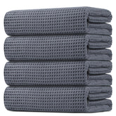 HOMEXCEL towel front view showing grey waffle weave and neat folds for quick-dry benefit