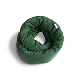 Huzi Infinity Pillow front view showing pine green color and loop design for versatile support