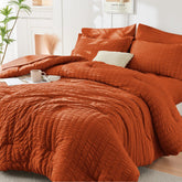HYMOKEGE front packaging showing burnt orange comforter set and included pieces