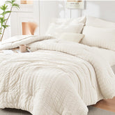 HYMOKEGE ivory comforter front view showing neat packaging and instant bedroom upgrade