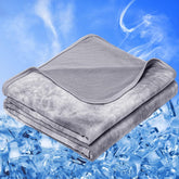 inhand front view of full-size gray cooling blanket showing smooth surface and coverage