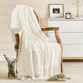 inhand front view of off white throw showing full design and cozy appeal