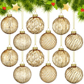 Jenaai gold glass ornament front view showing warm metallic shine and elegant finish