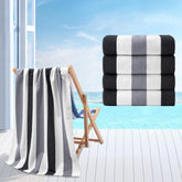 Jessy Home front view of four grey-black striped towels showing compact pack benefit