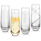 Joeyan front view of four etched champagne flutes showing elegant designs and balance