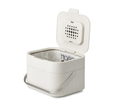 Joseph Joseph front view of stone compost caddy showing compact countertop fit and tidy design