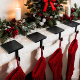 Joyyy front view of four black cast iron holders showing classic silhouette and stability