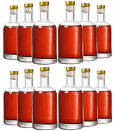Kaachli clear glass bottles front pack showing neat set and presentation benefit