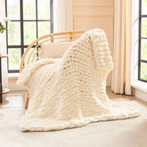 L'AGRATY front view of ivory throw showing neat finish and cozy look