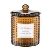 LA JOLIE MUSE front view of Sahara Amber candle showcasing jar and label, elegant giftable look