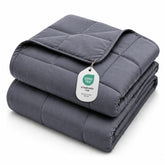 L'AGRATY front view of dark grey weighted blanket showing neat drape and comfort