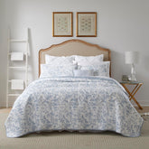 Laura Ashley front view of quilt showing Amberley Blue toile and neat drape, adds timeless charm