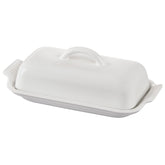 Le Creuset butter dish front view showing glossy white finish and elegant shape for refined storage