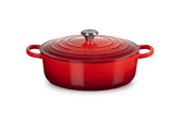 Le Creuset front view showing cerise enamel and sturdy handles for visual appeal