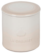 Le Creuset garlic keeper front view showing meringue color and stylish storage benefit