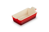 Le Creuset loaf pan front view showing cerise color and oven-to-table appeal