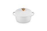 Le Creuset mini cocotte front view showing white finish and festive design for elegant serving