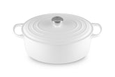 Le Creuset front view showing oval shape and white finish, kitchen-ready