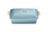 Le Creuset front view of rectangular casserole showing shape and Sea Salt finish benefits serving