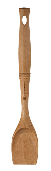 Le Creuset spoon front view showing beech wood and blunt scraping edge, protects cookware