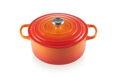 Le Creuset round Dutch oven front view in Flame showing color and shape, stylish serving benefit