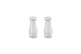 Le Creuset front view of white salt and pepper shakers showing elegant shape and durability
