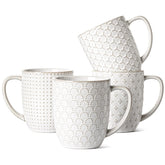 LE TAUCI front view of four white mugs showing set balance and gift-ready look