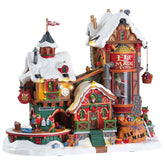Lemax Elf Made Toy Factory front view showing animated exterior and festive lighting benefit