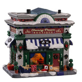 Lemax Fancy Paws Boutique front view with warm light inviting shoppers