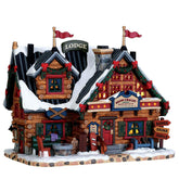 Lemax Après-Ski Lodge front view showing porcelain chalet and glowing windows to attract attention