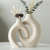 Levvohd front view of both vases showing sculptural hollow and matte finish