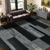 LIANLAM front view of black and gray 8x10 rug showing mid-century design and anchoring benefit