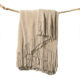 lifein folded throw blanket on couch showing neat styling and cozy appeal