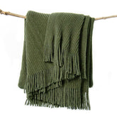lifein olive green throw folded on table showing neat front and shape benefit cozy decor
