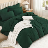 Litanika comforter front view in emerald showing full bed coverage and polished look