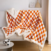 LOMAO folded throw front view showing orange checkered design and cozy appeal
