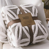 LOMAO throw front view showing grey face and cozy look, adds soft decor