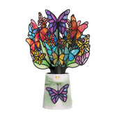 Lovepop front view of bouquet showing colorful butterfly wings and floral base, bright display benefit