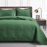 Love's cabin front view of dark green queen bedspread showing modern look and easy styling