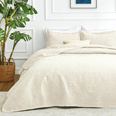 Love's cabin quilt front view showing full oversized beige coverage and neat finish