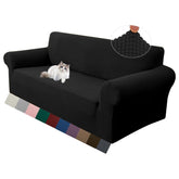 LURKA front view on loveseat showing smooth black tailored fit and refreshed look